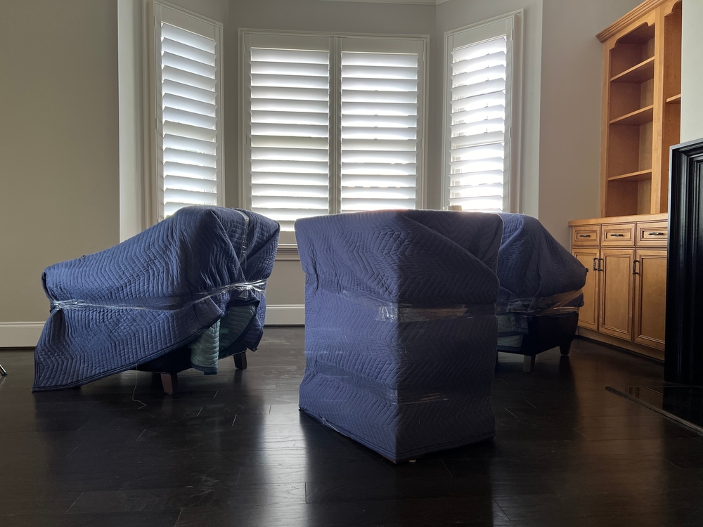 Furniture,Wrapped,In,Pads,To,Be,Moved,From,An,Almost