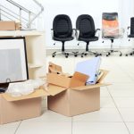 Move,Concept.,Unpacking,Cardboard,Boxes,In,A,New,Office