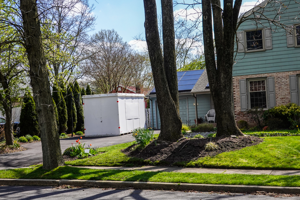 White,Storage,Pod,Unit,In,The,Driveway,Of,A,Home